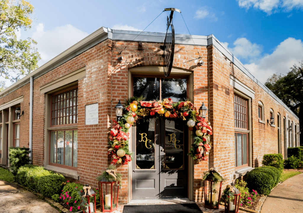 Historic industrial chic brick building, Butler's Courtyard, a wedding venue in League City, Texas, near Houston, beautifully decorated for the holiday season, perfect for December weddings and festive holiday parties.