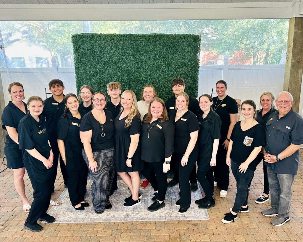 A group photo of the Butler's Courtyard Team, including Coordinators, Bartenders, servers and the Owners.