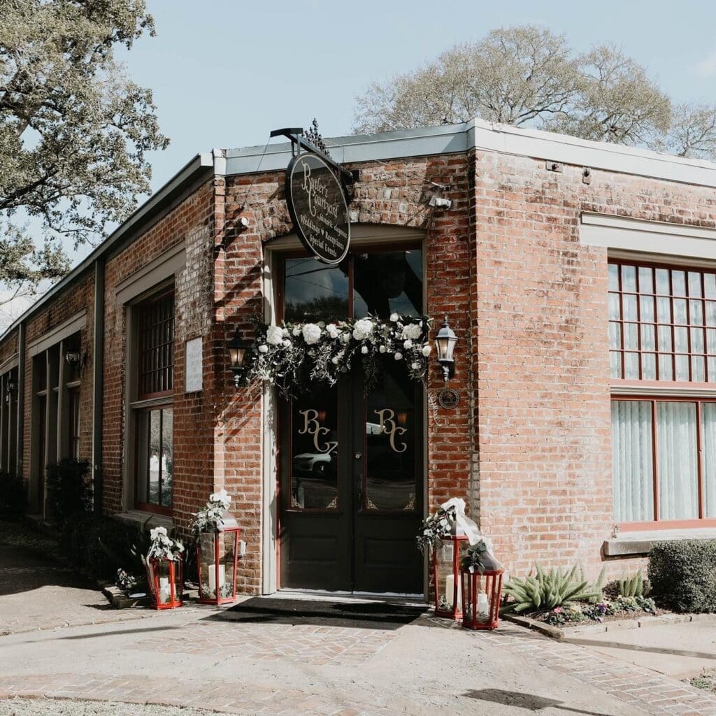 Alt Text: Front door of Butler's Courtyard, a charming historic red brick building with elegant architectural details, perfect for creating a memorable wedding atmosphere for your 2025 celebration.