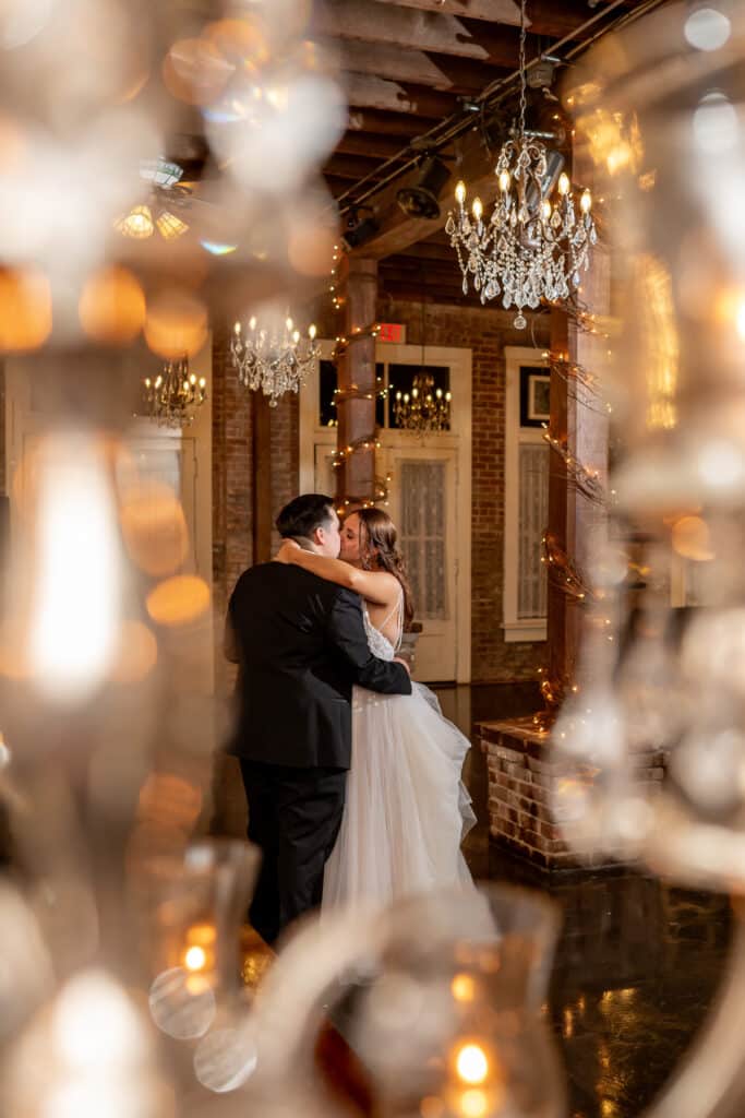 Bride and Groom share a romantic kiss in the Grand Hall at Butler's Courtyard during their private last dance