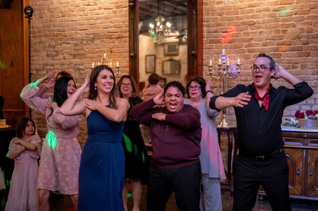 Guests pack the dance floor during the macarena a beloved line dance that always gets guests on their feet!