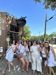girls night out at white linen night, group of ladies dressed in white drinking frozen drinks during League City's art walk